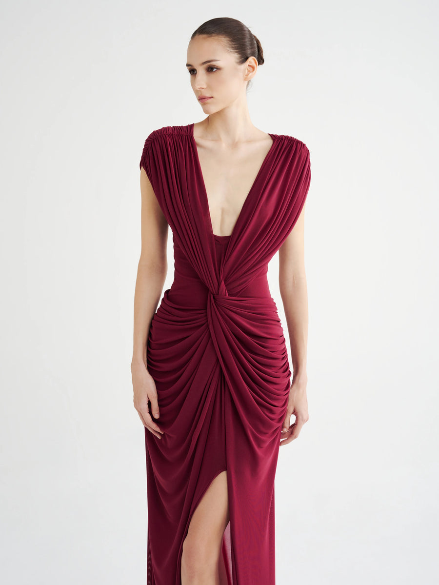 Model in the Draped Twist-Front Gown in burgundy AirMesh™, with a plunging V-neck and twisted waist