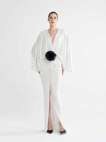 White Rosette Plunging Batwing Ruched Dress with a black rosette at the waist, front view