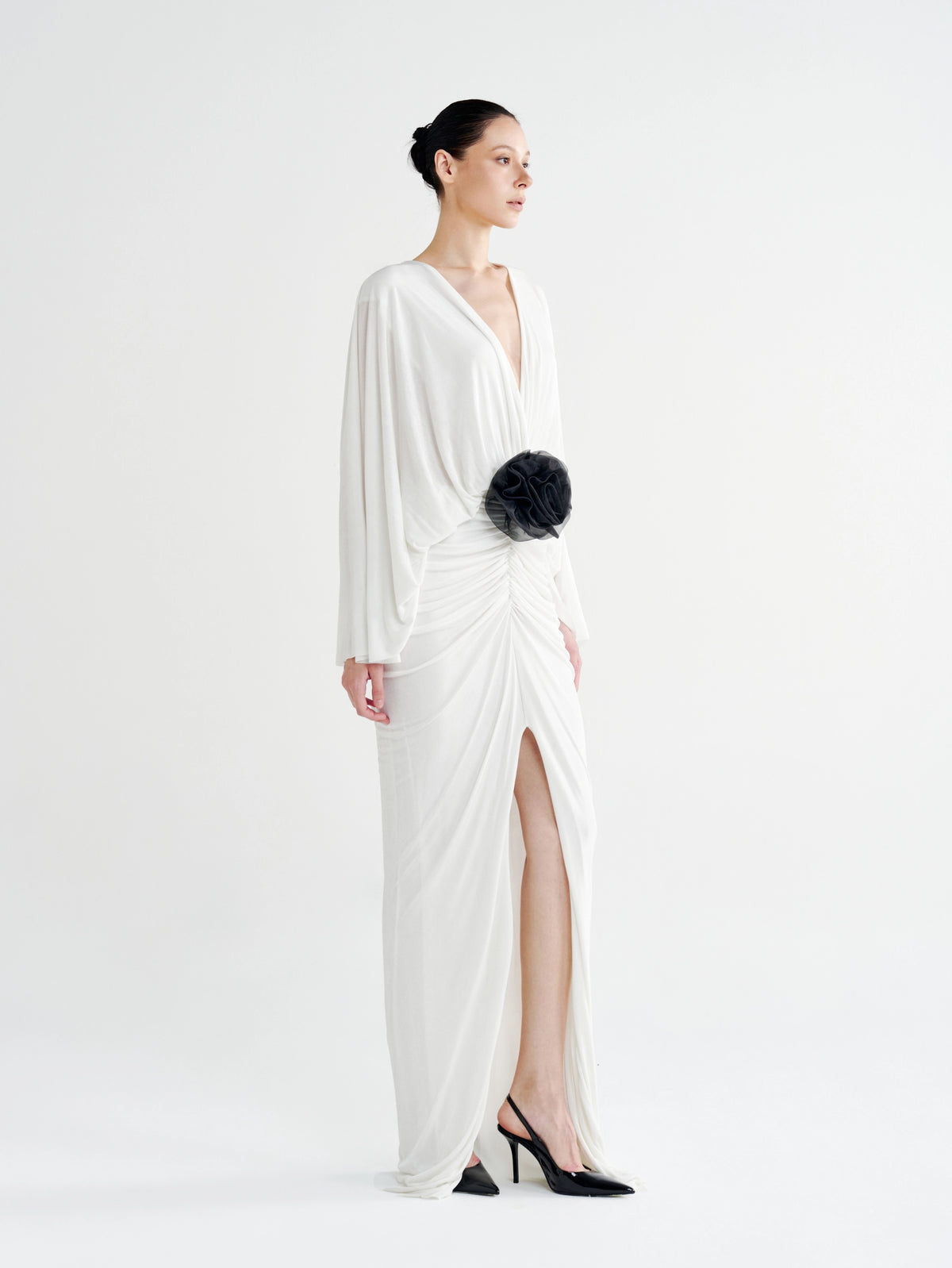 White Rosette Plunging Batwing Ruched Dress, side view of the split maxi hem