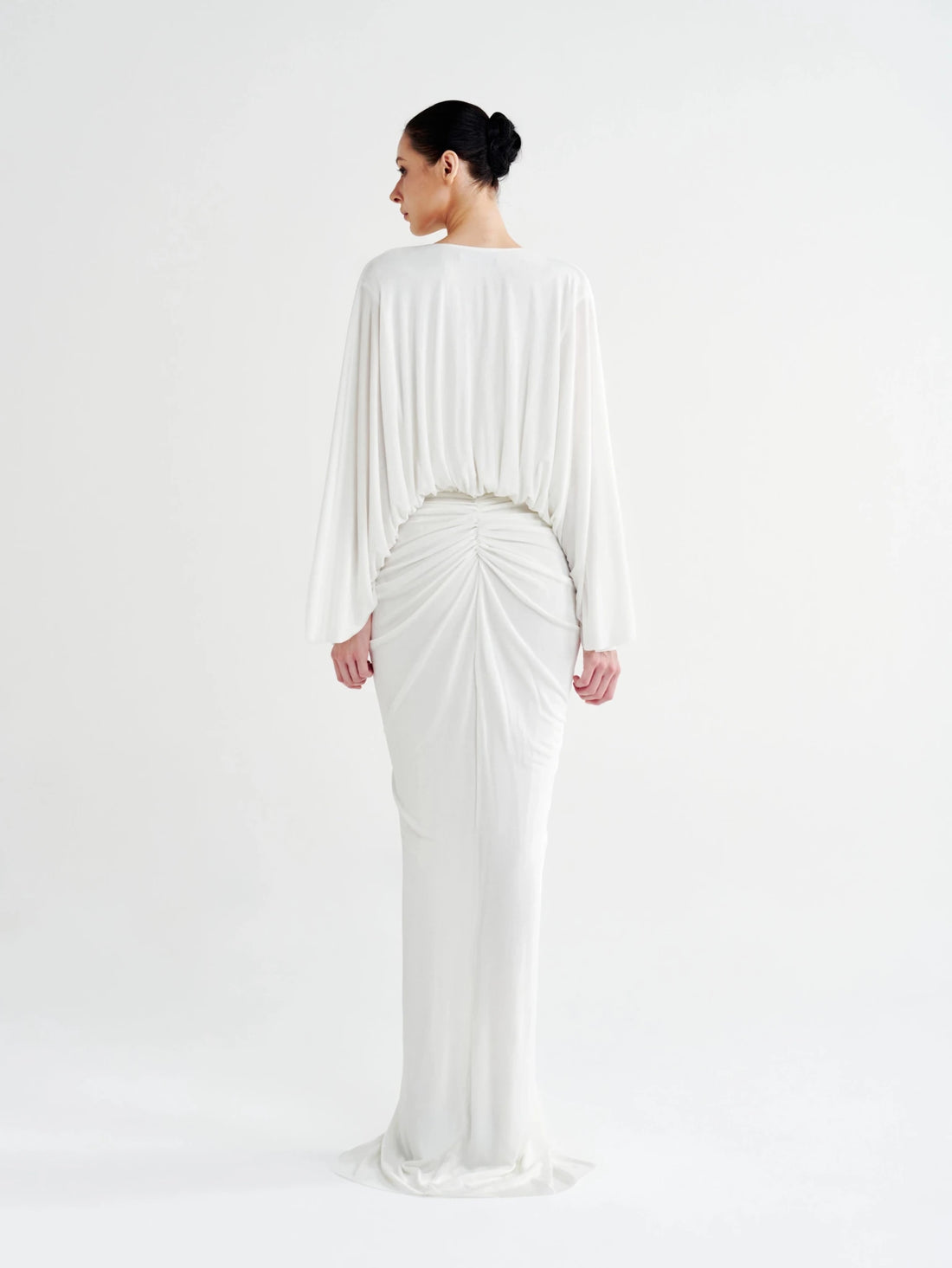 White Rosette Plunging Batwing Ruched Dress with a black rosette at the waist, front view